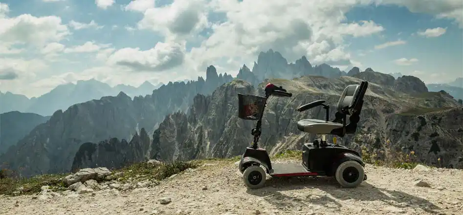 Electroquest Mobility Scooter and Wheelchair Batteries. Photo of a mobility scooter on a mountain path.